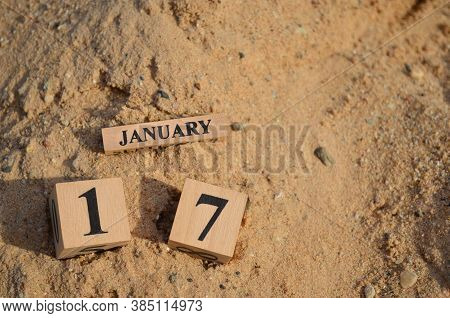 January 17, Number Cube With A Sand Background.