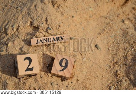 January 29, Number Cube With A Sand Background.