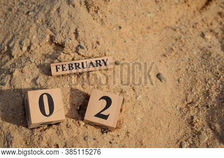 February 2, Number Cube With A Sand Background.
