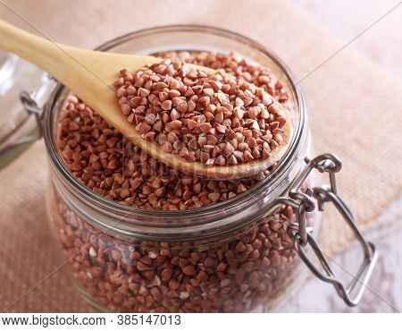 Buckwheat Groats In A Glass Jar. Close-up.