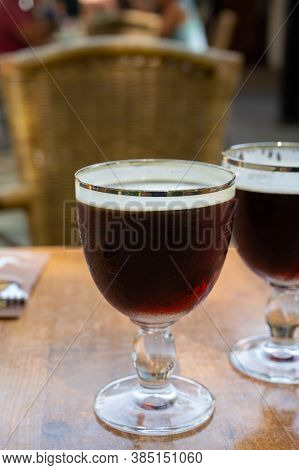 Glasses With Cold Dark Strong Belgian Beer Served Outdoor