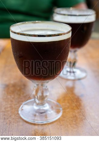 Glasses With Cold Dark Strong Belgian Beer Served Outdoor