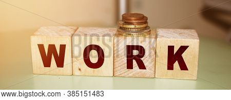 Work Word On Wooden Ocks And Coins. Business Career Concept