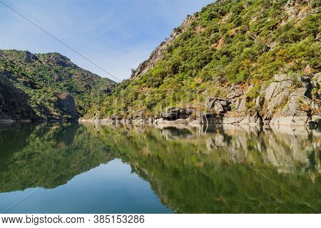 River Douro flowing through narrow rocky gorge in Portugal. Douro Region.