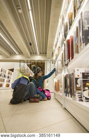 Calgary Alberta Canada, October 3 2017: Siblings Choose Books At The Downtown Central Public Library