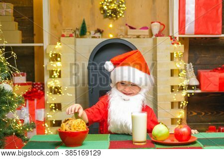 Santa Claus Takes A Cookie On Christmas Eve As A Thank You Gift For Leaving Presents. Happy New Year