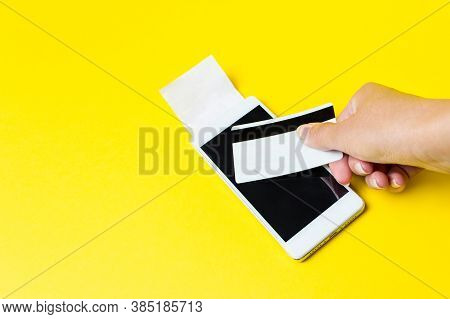 Mobile Payment With Virtual Wireless Nfc Technology. Hand Holding Credit Card And Using Smartfone As