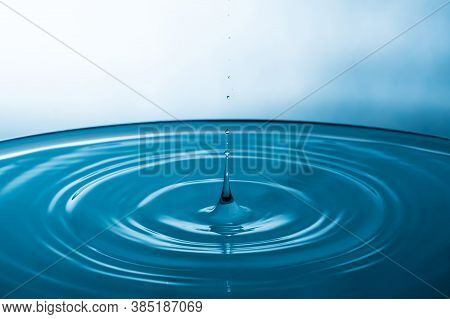 Abstract An Outbreak Of Water. Splash Of Water Close-up. Frozen Water Drop Photographed At High Spee