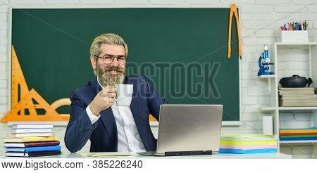 Want A Cup. Bearded Man Relax Drinking Coffee In Class. Thirsty Teacher. Drinking Tea Habit. Drinkin