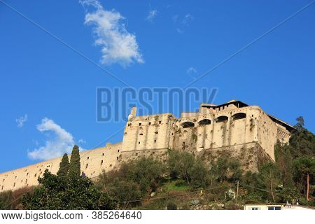 Ancient Ducal Fortress Perched On A Green Hill. Building Overlooking The Plain In The Blue Sky In Tu