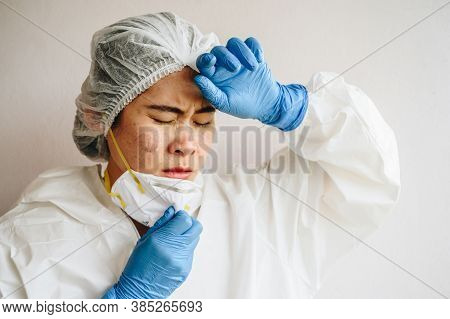 Healthcare Worker With Acne And Facial Wounds Occur From A Medical Mask After Work For A Longtime In