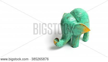 Figurine Of A Green Wooden Elephant With Gilding Isolated On White Background. Decorative Figurine O