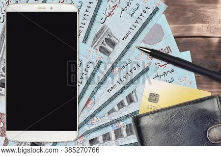 5 Egyptian Pounds Bills And Smartphone With Purse And Credit Card. E-payments Or E-commerce Concept.