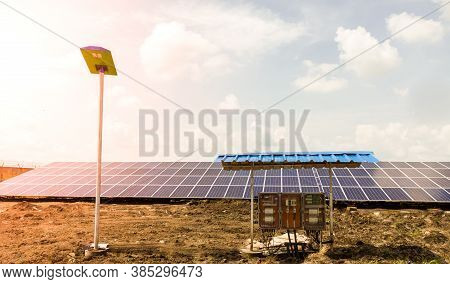 Row Of Installed Photovoltaic Solar Panels Or Modules, Solar Street Light And String Combiner Box, S
