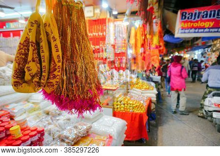 Haridwar, Garhwal, India - 3rd November 2018 : Auspicious Yellow Merchandise Hanging For Sale. Night