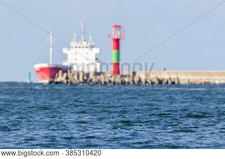 Sea Water On A Sunny Clear Day - Seascape With A Ship In The Background
