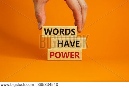 Male Hand Placing A Block With Word 'words' On Top Of A Blocks Tower With Words 'words Have Power'. 