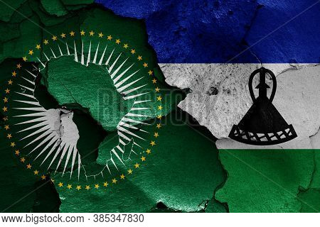 Flags Of African Union And Lesotho Painted On Cracked Wall