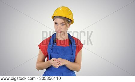Construction Female Worket Explaining Her Ideas To Camera On Gra