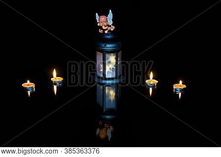 The Little Toy Angel, Candles, Flashlight, Reflection, Night, Black Background. Mysticism