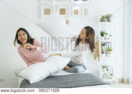 Two Pretty Best Friends Forever Girlfriend Talk, Hug And Laugh Together On Bed At Cozy Home Relation