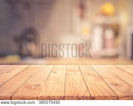 Wood Texture Table Top (counter Bar) With Blur Light Gold Bokeh In Cafe,restaurant Background.for Mo