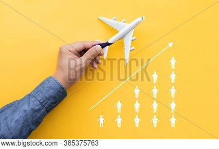 Business Transportation Or Aviation With Male Hand Holding Mockup Airplane And People Tourist Icon.g