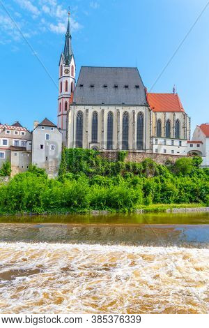 St Vitus Church In The Middle Of Historical City Centre. View From Vltava River. Cesky Krumlov, Sout