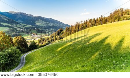 Romantic Sunset In The Mountains. Green Alpine Meadows And High Peaks Of Austrian Alps. Salzach Rive