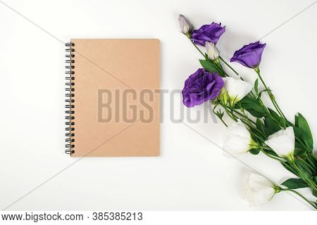 Floral Mockup With Notebook. Flowers And Notebook On White Background. Tender Eustonia Flowers. Flow