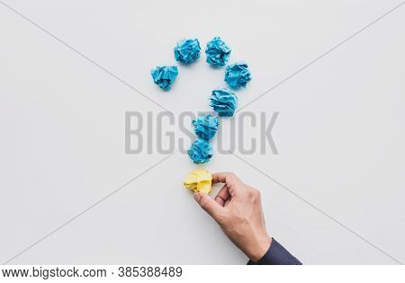Question And Answer Or Thinking Ideas Concepts With Male Hand Holding Paper Crumpled Ball.business S