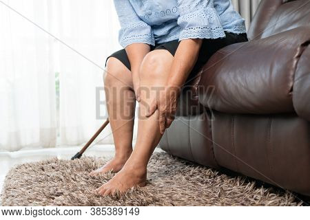 Leg Pain Of Senior Woman At Home, Healthcare Problem Of Senior Concept