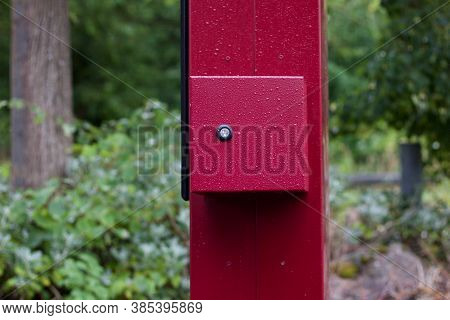 Dark Red Pillar With Red Box Attached With Key Hold
