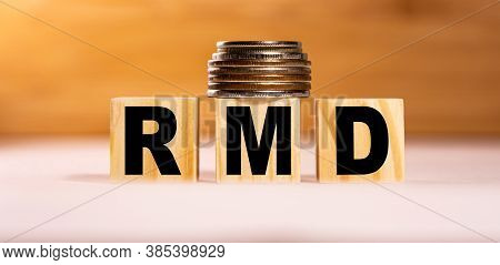 The Concept Of The Word Qa On Wooden Cubes With Coins On A White Wooden Background. Business Concept