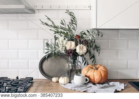 Autumn Still Life Composition In Rustic Eclectic Kitchen Interior. Cup Of Coffee, Vintage Silver Tra