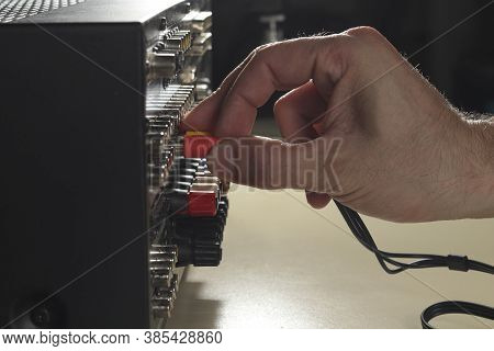 The Technician Connects The Audio Cables To The Rack