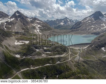 Dam And Wind Farm On Nufenen Pass In Switzerland