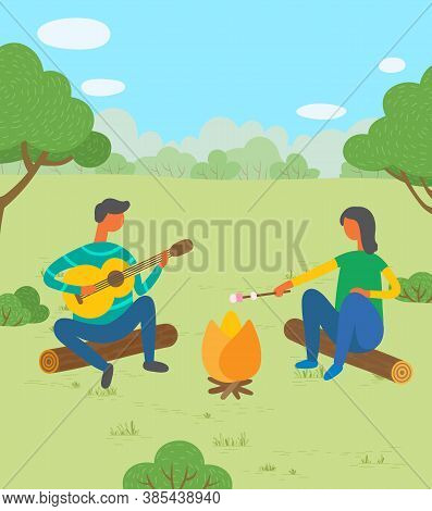 Man And Woman Friends Camping. They Are Sitting Around Camp Fire And Playing Guitar, Toast Marshmall