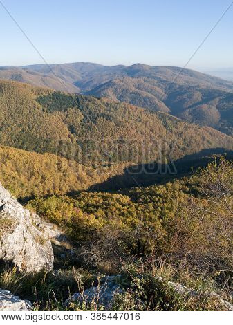 Scenic View From The Slope Of The Kozara Mountain Overgrown With Forest During A Sunny Day Against T