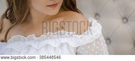 Close Up Picture Of Girl Shoulders In White Ruffle Dress With Gold Tattoo Bride. Hen Party With Girl
