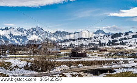 Panoramic View On Bialka Tatrzanska Village In Winter, With Snowy Tatra Mountains In The Background,