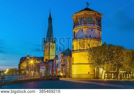 View Of Dusseldorf Historic Center With Old Castle Tower And St Lambertus Church In Evening, Germany