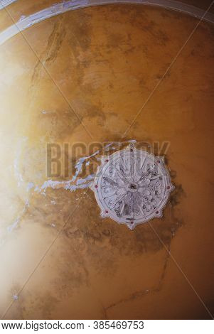 Beige Vintage Cracked Ceiling With Stucco In Old Abandoned Mansion.