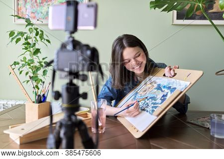 Artist, Teenage Girl, Draws Records On Video Camera For Blog. Paints, Drawings On Home, Camera On Tr