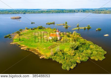Gothic Church of St. Linhart on island in  Vestonice reservoir. South Moravia, Czech Republic.