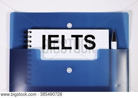 Ielts. Text On White Paper On Light Blue Backdrop