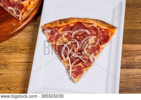 Slice Of Pepperoni Pizza In Brazil Is Called Pizza De Calabresa. Close Up.