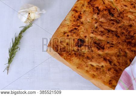 Homemade Italian Focaccia Modenese, With Rosemary And Olive Oil. Freshly Baked Flat Bread Whit Herbs