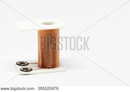 A Coil With Copper Wire That Forms Part Of An Electric Magnet
