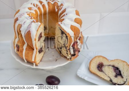 Typical German Poppy Seed Plum Gugelhupf Cake On A Table